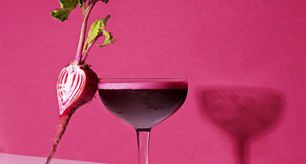 glass with beet against it
