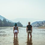 couple standing in lake
