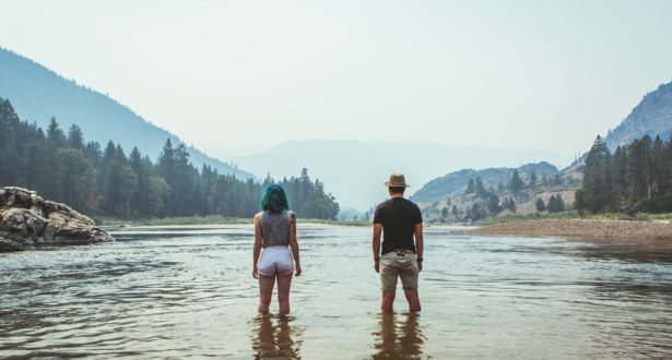 couple standing in lake