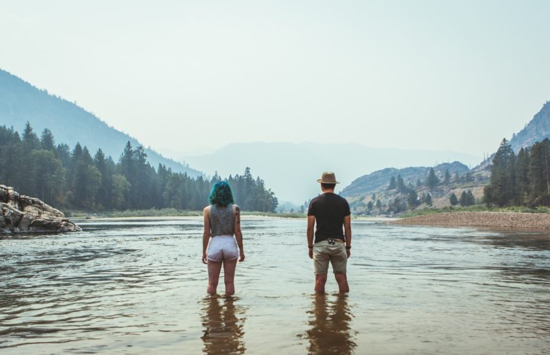 couple standing in lake